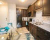 Granite Countertops, Tile Backsplashes, Woody Styled Floors 