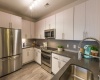 Quartz Countertops, Stainless Steel Appliances, Wood Styled Flooring