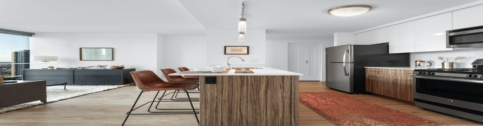 Stainless Steel Appliances, Kohler Kitchen features, Under-mount Sink, Duotone Cabinetry with High Glass White Uppers, Sparkling Flexed White Quartz, Plank Flooring Stainless Steel Appliances, Kohler Kitchen features, Under-mount Sink, Duotone Cabinetry with High Glass White Uppers, Sparkling Flexed White Quartz, Plank Flooring