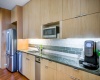 Flat Panel Cabinetry, Granite Countertops, Gas Cooking, Stainless Steel Appliances