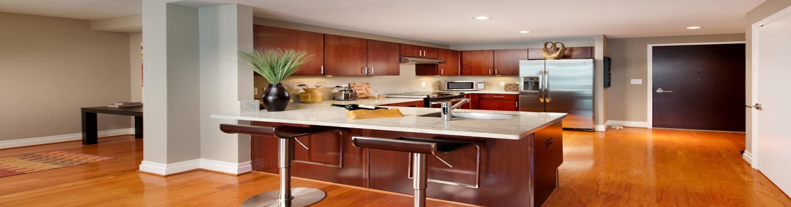 Spacious Design with Kitchen Islands, Merillat Sedona Cabinetry, GE Energy Star Stainless Steel Appliances, Kashmire White Granite Countertops