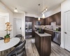 Stainless Steel Appliances, Quartz Countertops, Glass or Subway Tile Backsplash
