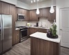 Stainless Steel Appliances, Quartz Countertops, Glass or Subway Tile Backsplash