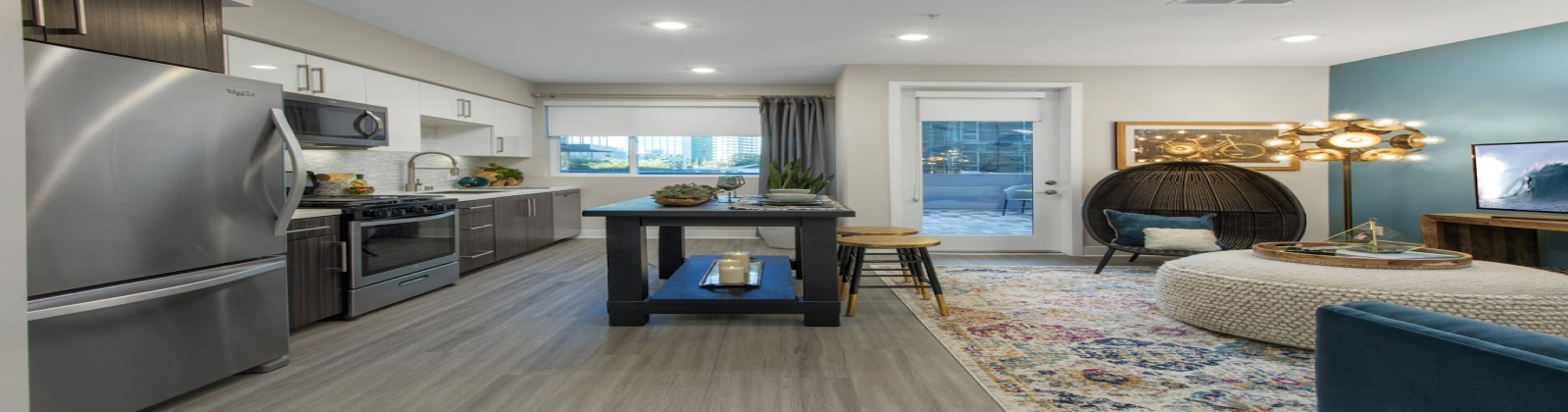 Stainless Steel Appliances, contemporary wood-look plank flooring, glossy white cabinetry, quartz countertops, full tile backsplash, pendant lighting in kitchen islands Stainless Steel Appliances, contemporary wood-look plank flooring, glossy white cabinetry, quartz countertops, full tile backsplash, pendant lighting in kitchen islands