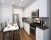 Island Kitchens, hard surface flooring, quartz countertops, subway tile backsplash, stainless steel appliances 