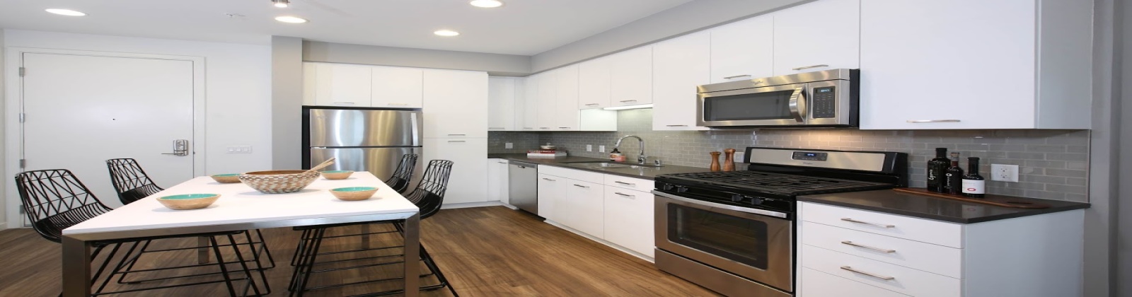 Island Kitchens, hard surface flooring, quartz countertops, subway tile backsplash, stainless steel appliances 
