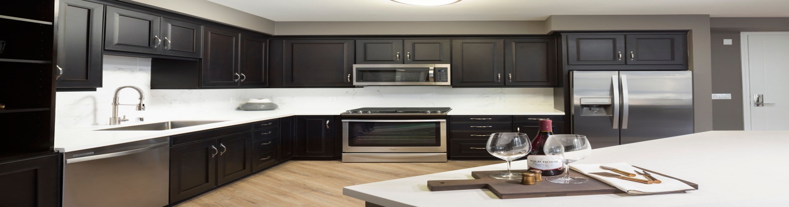 Wood plank style flooring, quartz countertops, stainless steel appliances, built in wine fridge, soft close cabinet and drawers Wood plank style flooring, quartz countertops, stainless steel appliances, built in wine fridge, soft close cabinet and drawers
