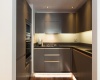 Bespoke finishings, gourmet with granite countertops, stainless steel appliances, 