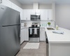 Quartz countertops, tile backsplashes