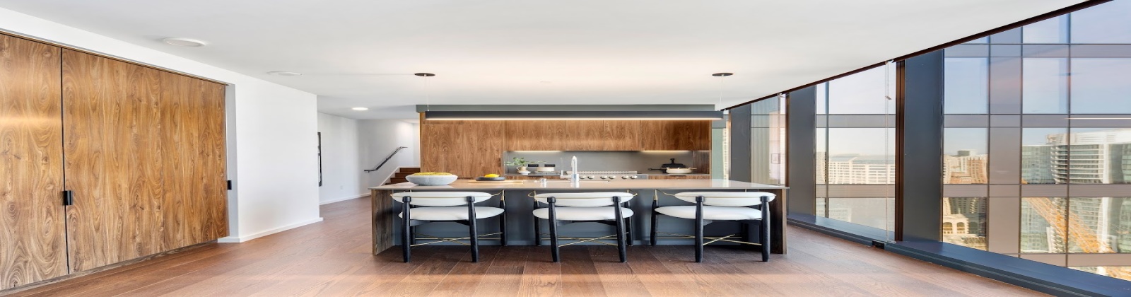 Neutral quartz countertops, full stone backsplash, integrated and panelized appliances, soft core cabinetry, wide plank wood flooring Neutral quartz countertops, full stone backsplash, integrated and panelized appliances, soft core cabinetry, wide plank wood flooring