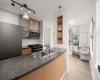 Granite/ stone/ quartz countertops, stainless steel appliances