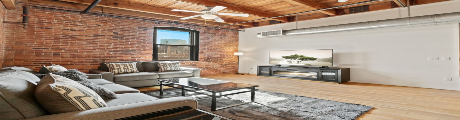 Fully Furnished Modern Loft in Historic Icehouse Building Steps from Union Station, Denver, CO

Discover urban living at its finest in this stunning fully furnished 1-bedroom, 1-bathroom loft in the iconic Icehouse Condominium Building, located in the heart of LoDo (Lower Downtown) Denver next to Union Station. This loft offers the perfect blend of industrial charm and modern comfort with exposed brick walls, wood-beamed ceilings, and a skylight.

The open-concept layout features a spacious living area with stylish furnishings, opening to the kitchen and dining areas and a large island — perfect for entertaining. The bedroom offers ample space, king sleep by number bed and a large walk-in closet, while the bathroom has a shower/tub.  This property also includes in-unit laundry, hardwood floors, and central HVAC.

The Icehouse Building offers top-notch amenities, including a rooftop deck with BBQ area, a fitness center, secure entry, and 1 assigned garage parking space in the rear of the building.

Situated just steps from Union Station, Coors Field, restaurants, breweries, and boutiques, this loft offers the ultimate walkable lifestyle. Whether you’re relocating or looking for a turnkey investment, this property is move-in ready and waiting for you.
