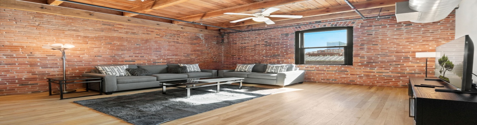 Fully Furnished Modern Loft in Historic Icehouse Building Steps from Union Station, Denver, CO

Discover urban living at its finest in this stunning fully furnished 1-bedroom, 1-bathroom loft in the iconic Icehouse Condominium Building, located in the heart of LoDo (Lower Downtown) Denver next to Union Station. This loft offers the perfect blend of industrial charm and modern comfort with exposed brick walls, wood-beamed ceilings, and a skylight.

The open-concept layout features a spacious living area with stylish furnishings, opening to the kitchen and dining areas and a large island — perfect for entertaining. The bedroom offers ample space, king sleep by number bed and a large walk-in closet, while the bathroom has a shower/tub.  This property also includes in-unit laundry, hardwood floors, and central HVAC.

The Icehouse Building offers top-notch amenities, including a rooftop deck with BBQ area, a fitness center, secure entry, and 1 assigned garage parking space in the rear of the building.

Situated just steps from Union Station, Coors Field, restaurants, breweries, and boutiques, this loft offers the ultimate walkable lifestyle. Whether you’re relocating or looking for a turnkey investment, this property is move-in ready and waiting for you.
